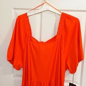 This is the cutest orange sun dress.